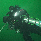 Diver on line with several tanks